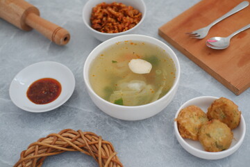 traditional Indonesian meal arranged neatly on a marble background