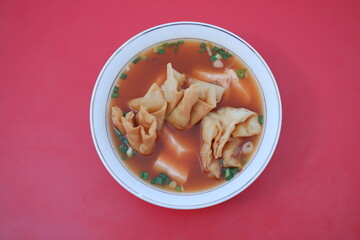 delicious red tofu soup with crackers