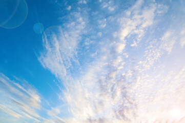 Blue cloudy sky landscape with white dramatic clouds - vast blue cloudy sky view