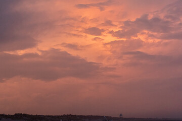 Avalon, New Jersey, USA - The view from the ocean looking down the coastline with dramatic clouds above them in this beach town on the southern New Jersey shore