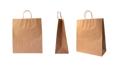 Set of three brown kraft paper shopping bags, from different angles isolated on white background. Eco-friendly recyclable packaging for retail stores, shopping related design.