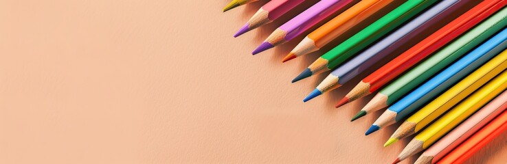 Colorful pencils, school supplies on a trendy beige light background. Many Office Stationery Items flat lay. Back to school concept. College tools props accessories. Top view, copy space. Wide banner