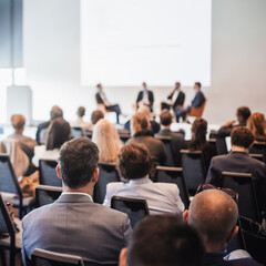 Interview and round table discussion at business convention and presentation. Audience at the conference hall. Business and entrepreneurship symposium.