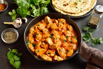 Delicious chicken tikka masala curry in cast iron pan