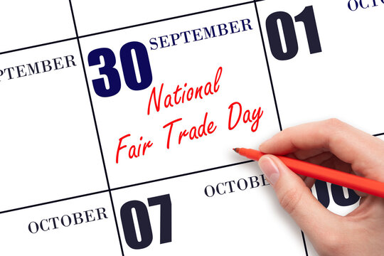 September 30. Hand writing text National Fair Trade Day on calendar date. Save the date. - Powered by Adobe