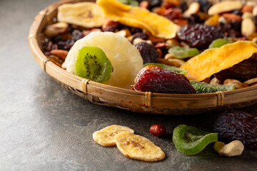 Dried tropical fruits with various nuts and raisins.