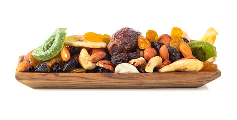 Dried tropical fruits, nuts, and raisins isolated on white.