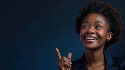 Optimistic Black Woman Smiling and Pointing Upwards on Dark Background
