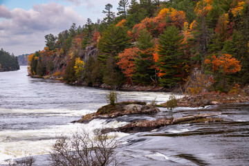 French River Rough Rapid Water Cascades of the Recollet Falls. Gray Stormy Autumn Day at French River in Killarney, Ontario, Canada