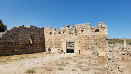 Wall remains and gate to the Roman baths in the Perge ancient city located in Aksu district of Antalya province in Turkey