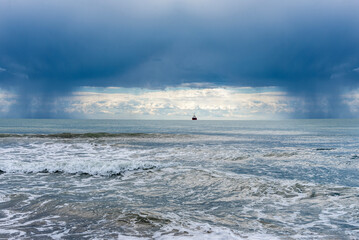 storm over the sea,before storm, ship on storm