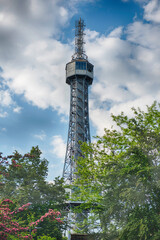 Obraz premium Petrin lookout tower rising above trees in Prague, Czech Republic