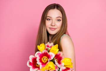 Fototapeta premium Photo of nice young girl fresh flowers wear top isolated on pink color background