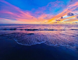 Vibrant Sunset Over Tranquil Ocean Waves. his serene seascape captures the beauty of nature, with vivid colors reflecting on the water, perfect for coastal decor or nature-inspired art.