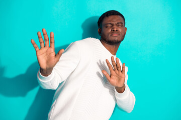 Photo portrait of pretty young male stop gesture disgusted avoid wear trendy white outfit isolated...