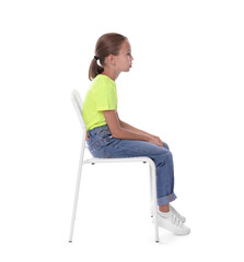 Girl with incorrect posture sitting on chair against white background
