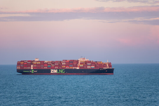 At sea, Atlantic Ocean - Large container ship ZIM SAMMY OFER owned by ZIM sailing through the Atlantic Ocean, near US coast. She is fully loaded with colorful containers.