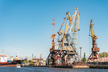 Huge cranes in the port at sea in Kaliningrad. Kaliningrad, Russia - 18 June 2024