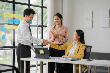 Business Deal Sealed: A handshake signifies the closure of a successful negotiation, as two...