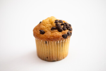 One chocolate chip muffin for breakfast on white background