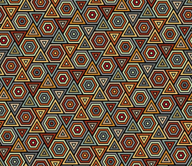 Abstract seamless geometric pattern with striped small hexagons and triangles. Ethnic style with gray, orange, yellow, and red lines on a black background. Vector illustration.