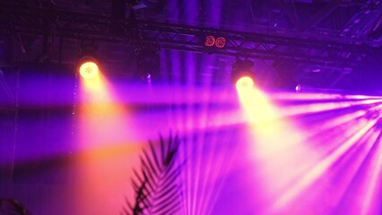 High Luminance Stage Disco Lights Casting Colorful Light Beams during Concert Gig Performance in...