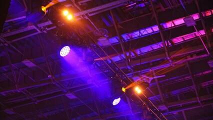 High Luminance Stage Disco Lights Casting Colorful Light Beams during Concert Gig Performance in...