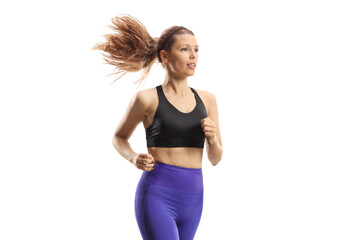 Slim young woman in sportswear running