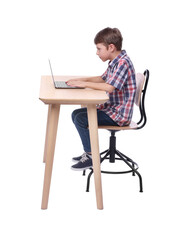 Boy with incorrect posture using laptop at wooden desk on white background