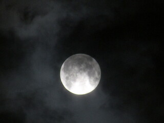 Full moon in the dark night sky