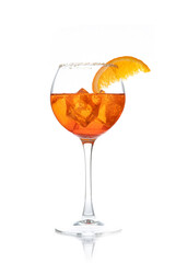 Aperol Spritz cocktail in glass with orange slice, sugar crumbs and ice cubes isolated on white background, copy space. Aperitivo