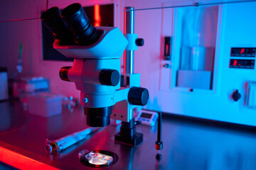 Laboratory microscope under contrasting red and blue light