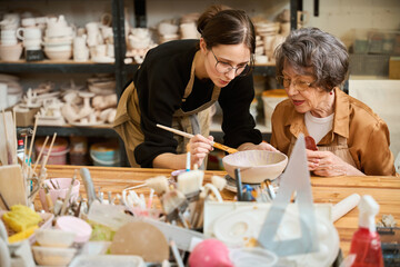 Elderly lady studies in a ceramics studio