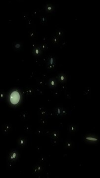 vertical animation of luminous round cotillons floating against a black background for festive designs