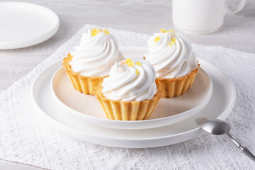 Baskets with protein cream on a white table
