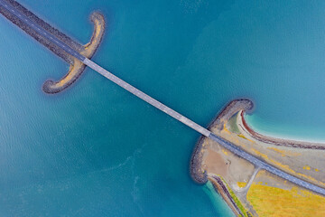 Icelant, travel destination in europe. Aerial vertical view by drone. Screen saver background abstract pattern of Sword Bridge.  Beautiful lines and colors.