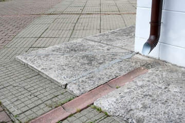 neat drainage for water from the building to the sidewalk in a special ditch, different tiles,...