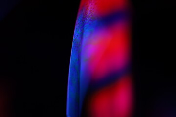 Red and purple fluid pattern, fluid background, fluid movement, red line, one bright line in the dark background 