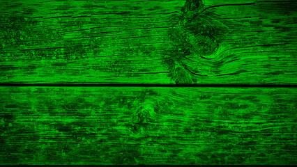 Bold, rustic wooden texture in vibrant green tones, showcasing natural grain patterns and cracks, perfect for eye-catching backgrounds, wallpapers, and creative designs