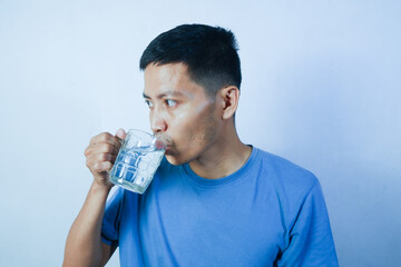asian man drinking water. white background