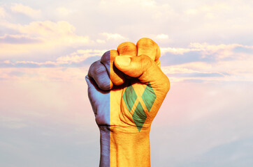 Man hand fist of Saint Vincent flag painted, fist flag, Strength, Power, Protest concept.