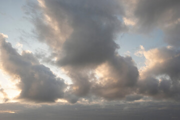 Evening sky with dramatic clouds. View of the sky in the afternoon. Blocky clouds with abstract shapes, patterns and textures. For graphic design or banner background