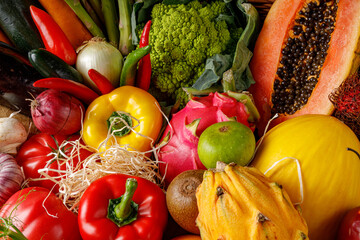 A vibrant and colorful assortment of fresh vegetables and fruits is beautifully displayed, ready for healthy meals