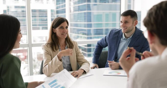 Business partners gather in meeting room, lead talk, share insights and business vision, take part in seminar or negotiations with shareholders, planning project, discussing risk management strategies