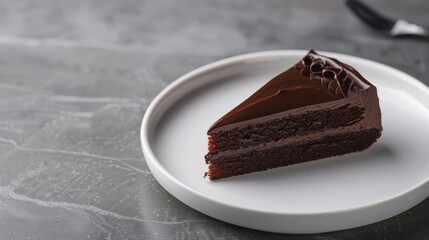 Decadent Slice of Chocolate Cake on White Plate: Elegant Dessert Display with Copy Space