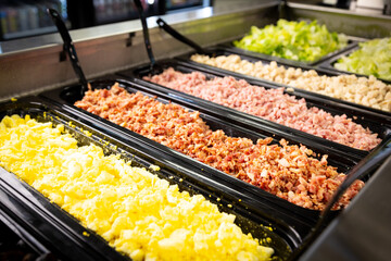 salad bar toppings at a restaurant