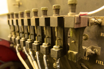 Electrical machine, rows of points set to make spark. A troubleshooting and testing device for aviation maintenance. Wires run to metal positions to simulate ignition in an internal combustion engine