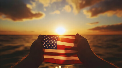 Holding the Flag at Sunset Over the Ocean