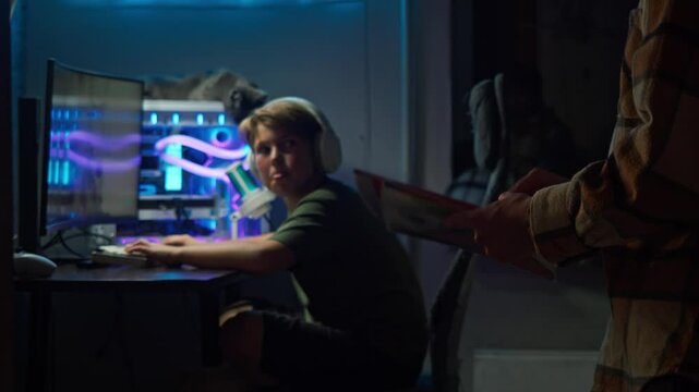 Father and child have agreed on the amount of time son is allowed to play computer games. After this, son will need to complete his homework.