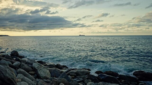 Slow motion of waves breaking on the rocks on a tropical beach at sunset. Macuto Coast, Venezuela.